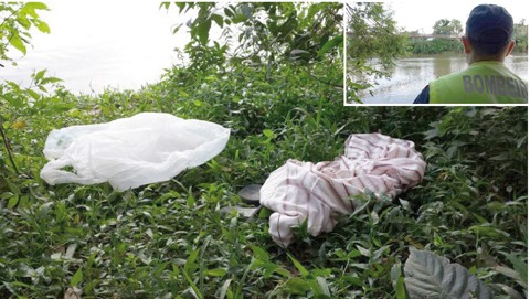 A vítima deixou seus pertence na beira do rio  -  Foto: Fabiano Joaquim e Fernando Sombrio/Repórter Sul/Notisul